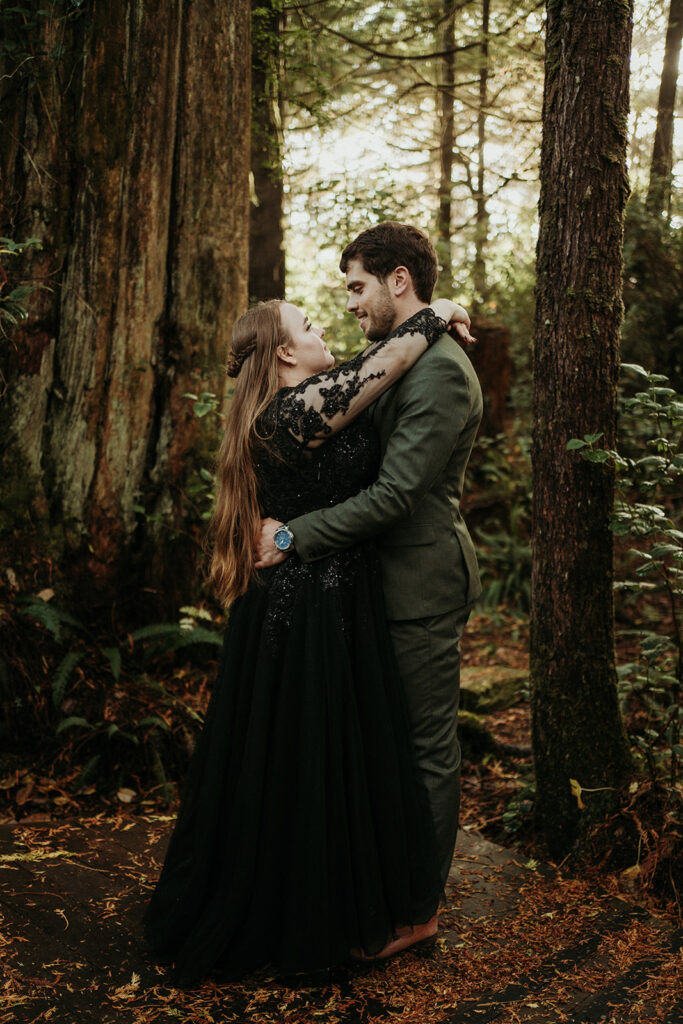 couple posing for their elopement photos in tofino vancouver island