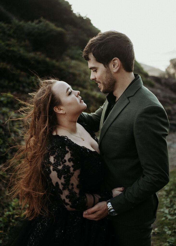 couple posing for photos in tofino vancouver island