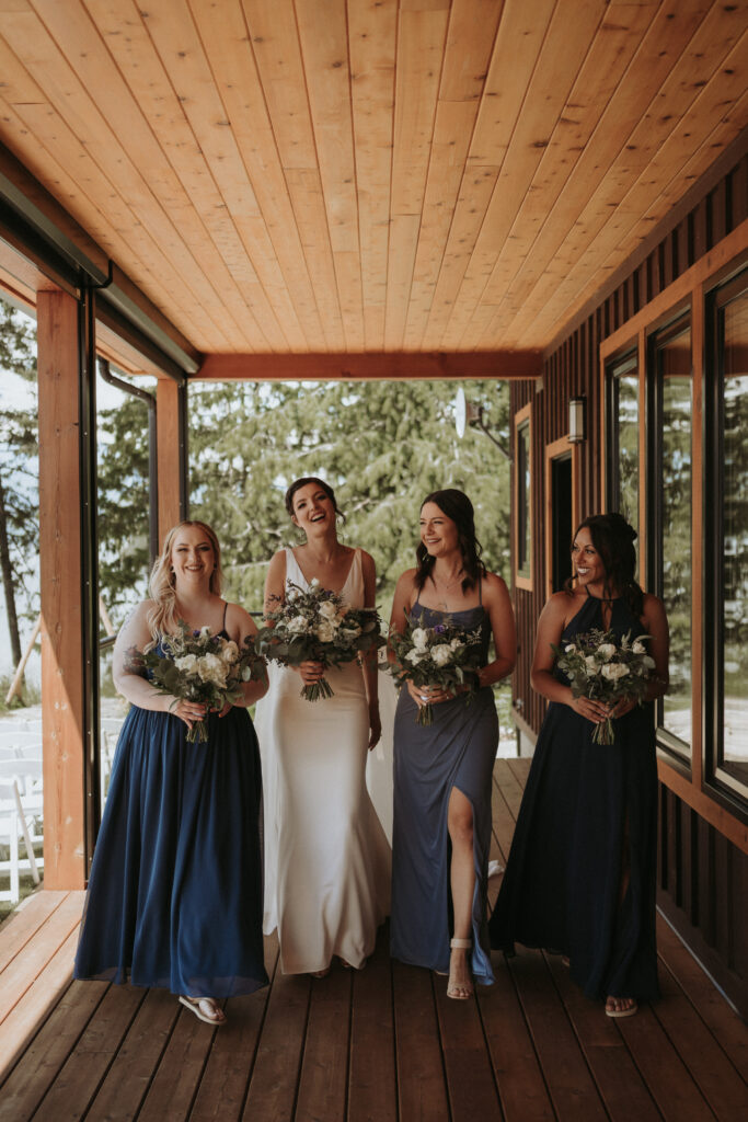 bride and bridesmaids posing for wedding portraits