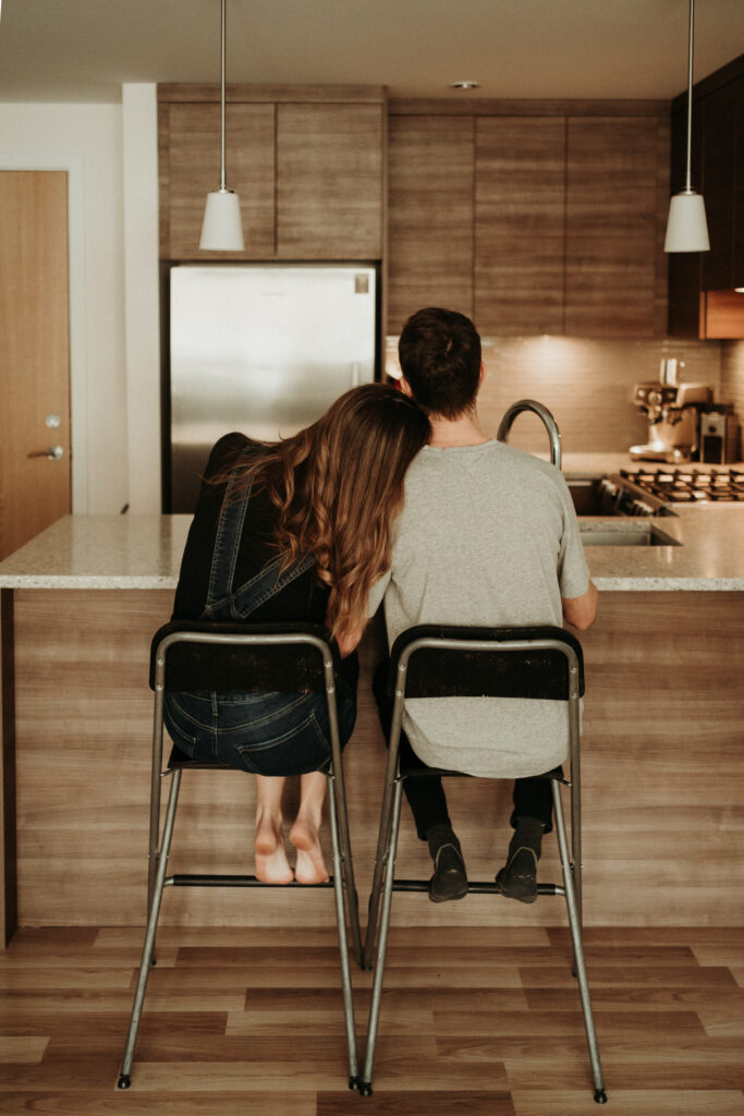 couple posing for their cozy engagement photos
