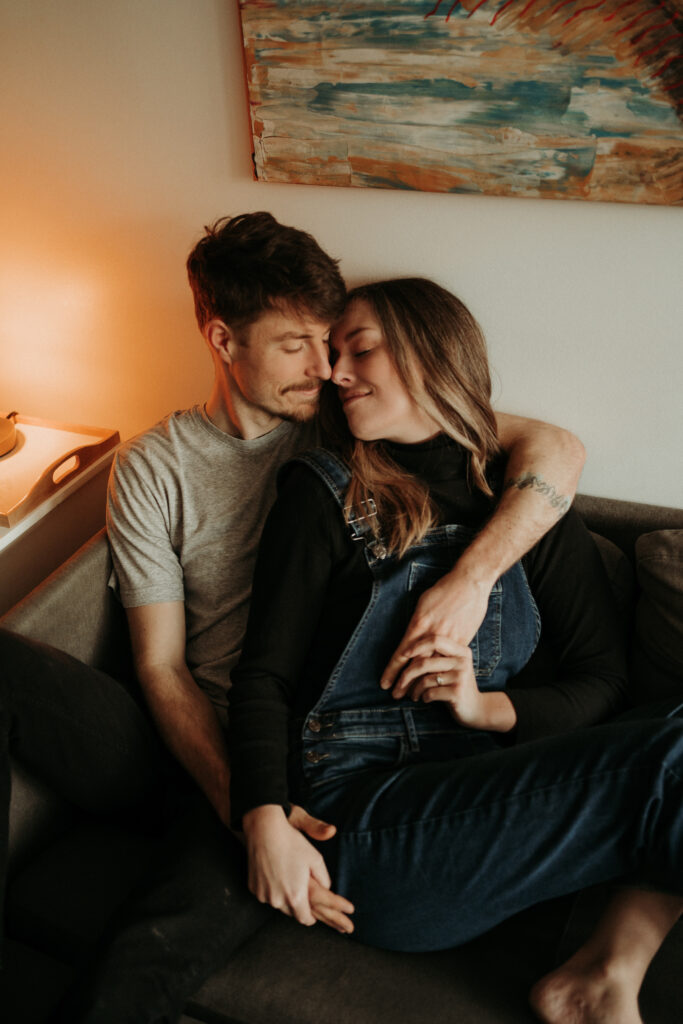 couple posing for their cozy engagement photos