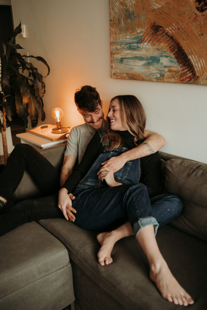 couple posing for their cozy engagement photos
