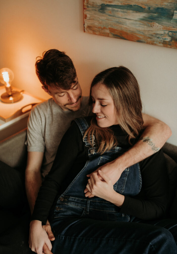 couple posing for their cozy engagement photos