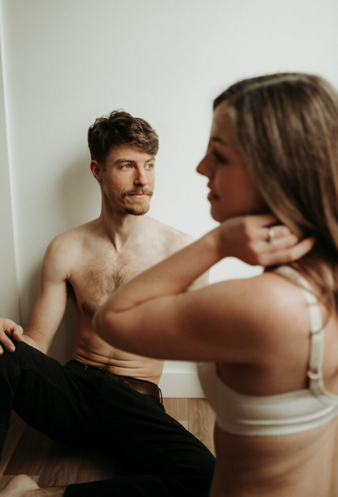 couple posing for their cozy engagement photos | At Home Engagement Photos