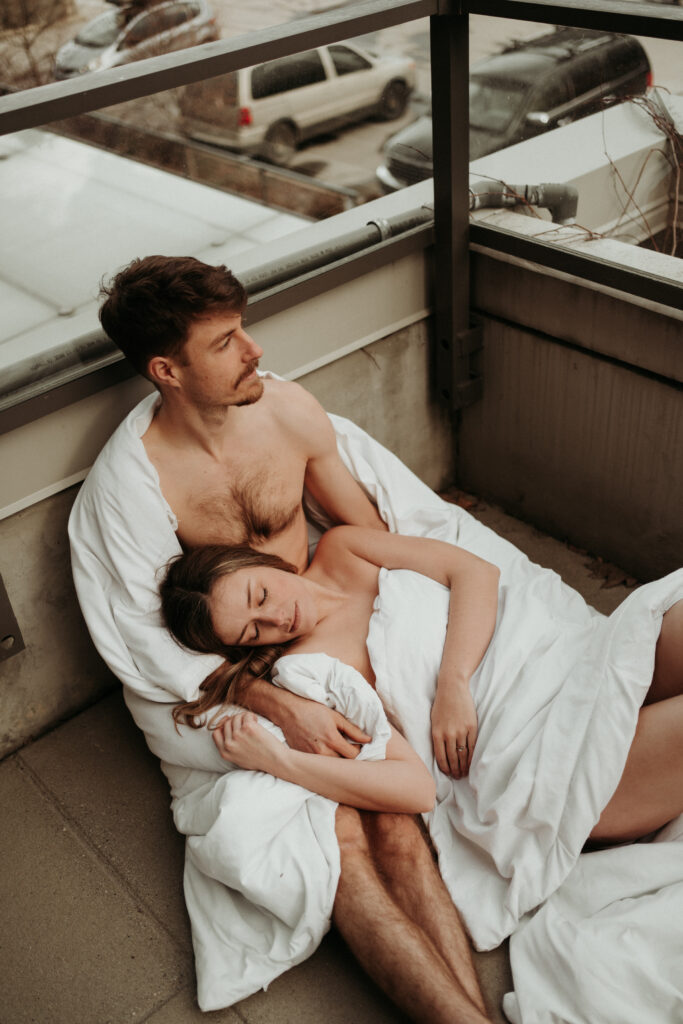 couple posing for their cozy engagement photos | At Home Engagement Photos
