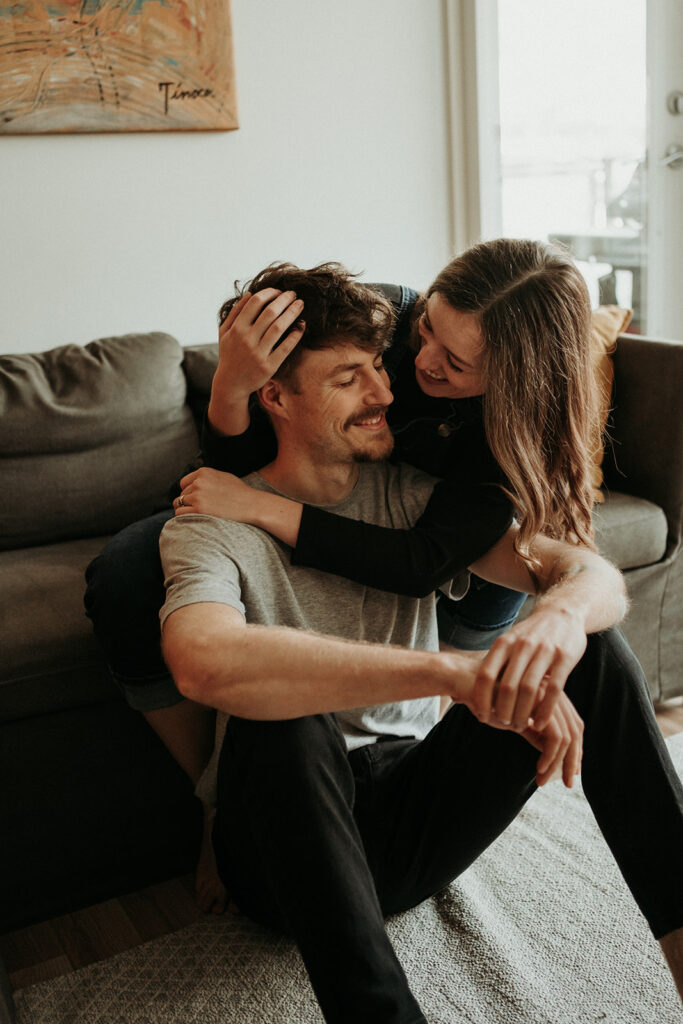 couple posing for their cozy engagement photos
