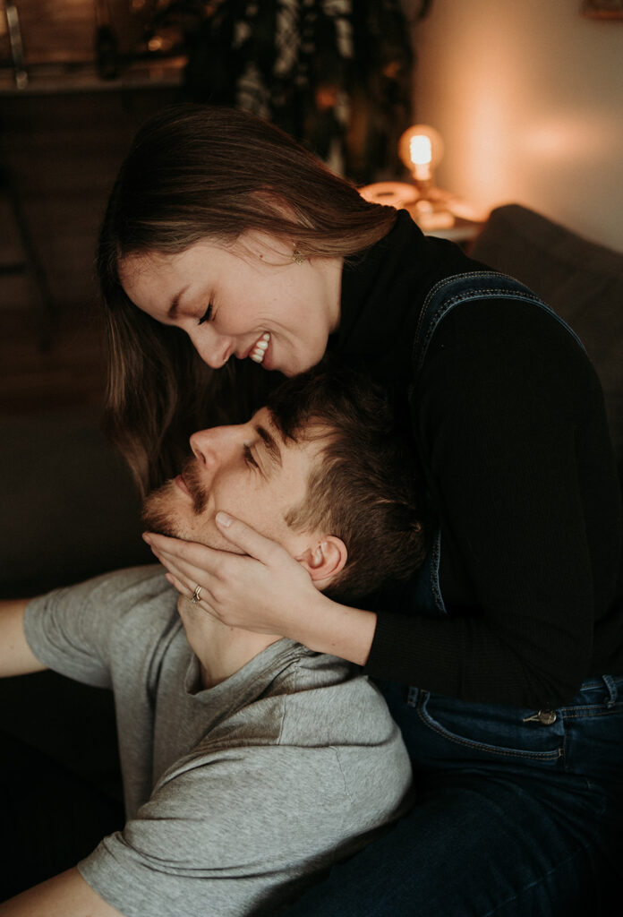 couple posing for their cozy engagement photos
