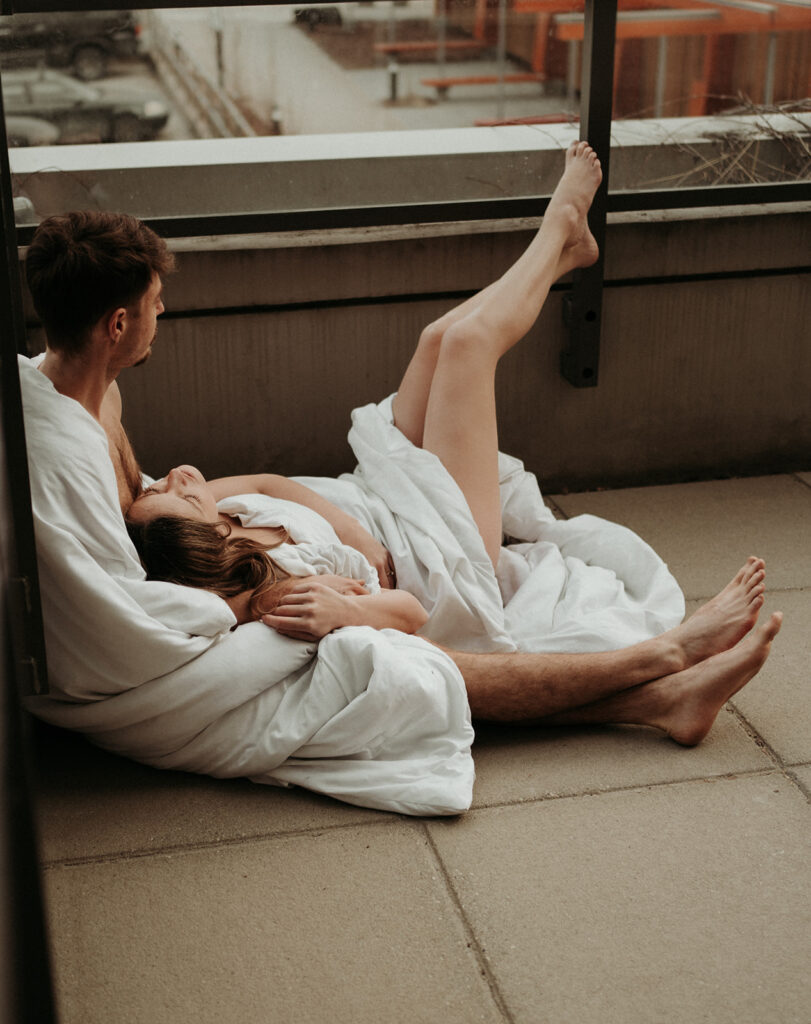 couple posing for their cozy engagement photos
