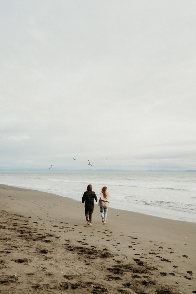 couple posing for their engagement photos on vancouver island